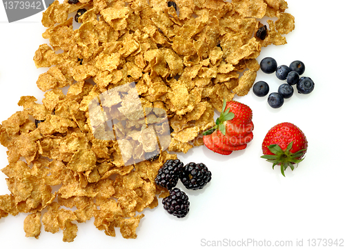 Image of bran and raisin cereal with fruits and berries 