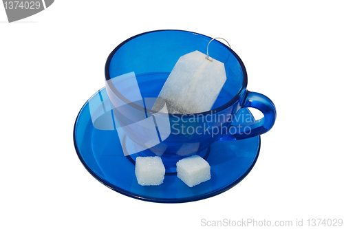 Image of A tea bag in a blue cup.