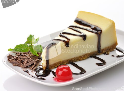 Image of cheesecake with chocolate sauce 