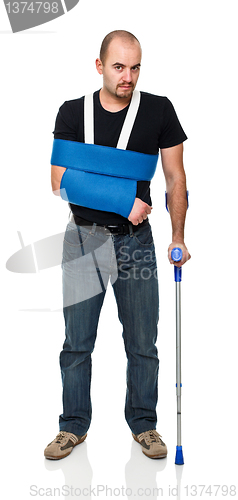 Image of man with crutch