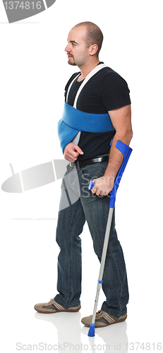 Image of man with crutch