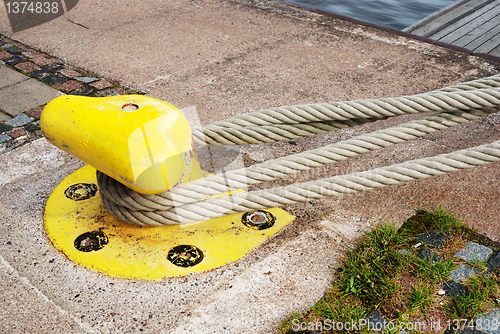 Image of yellow bollard in the port 