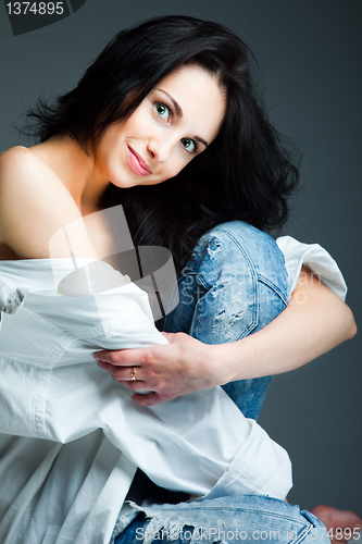Image of sexy young woman on wearing blue jeans