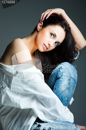 Image of sexy young woman on wearing blue jeans