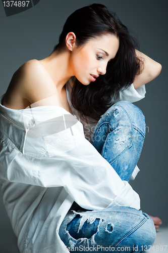 Image of sexy young woman on wearing blue jeans