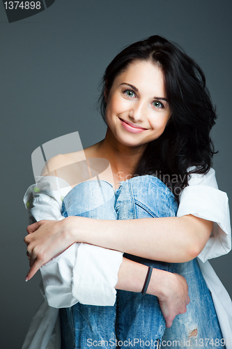 Image of sexy young woman on wearing blue jeans