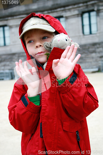 Image of Boy with toy lambkin