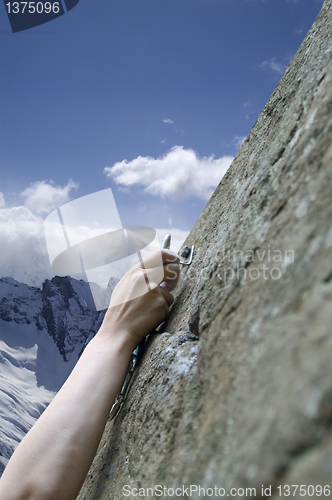 Image of Climber's hand with quick-draws