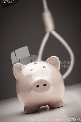 Image of Piggy Bank with Hangman's Noose in Background