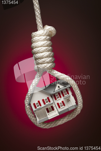 Image of House Tied Up and Hanging in Hangman's Noose on Red