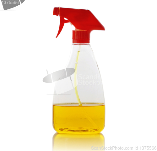 Image of spray bottle with yellow liquid 