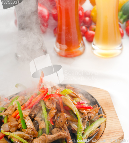 Image of original fajita sizzling hot  on iron plate