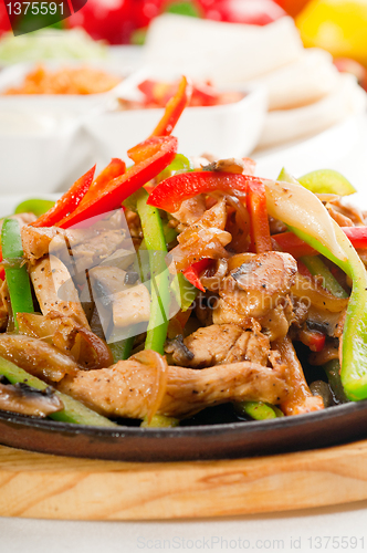 Image of original fajita sizzling hot  on iron plate