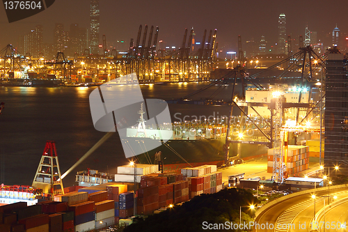 Image of container terminal at night in city