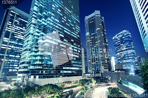 Image of Tall office buildings by night 
