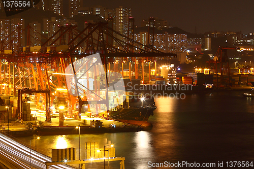 Image of container terminal at night in city