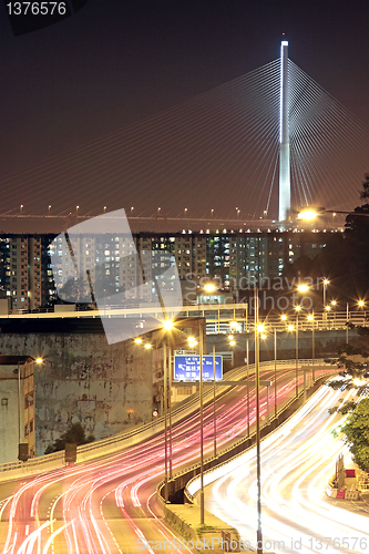 Image of traffic through downtown at night 