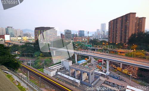 Image of very high-speed train go through the city