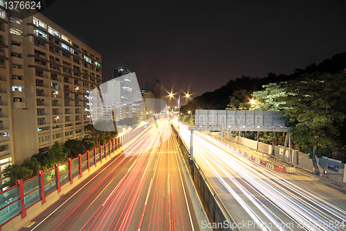 Image of traffic through downtown at night 