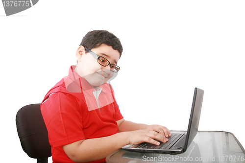 Image of young boy with computer isolated on white 