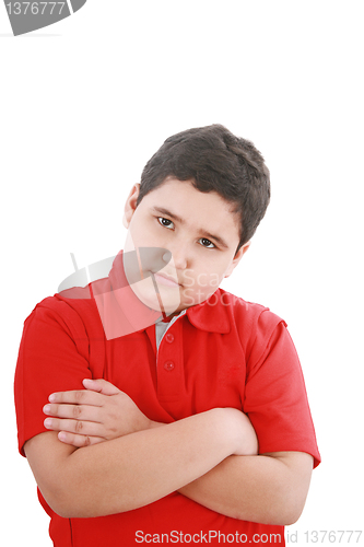 Image of serious little boy with hands folded standing isolated on white 