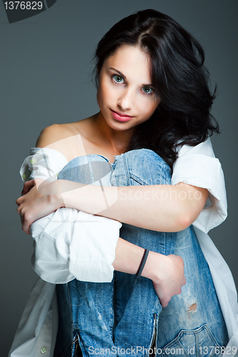 Image of sexy young woman on wearing blue jeans