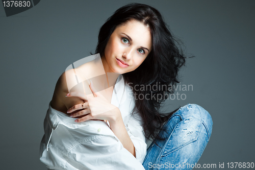 Image of sexy young woman on wearing blue jeans