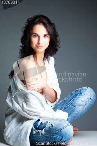 Image of sexy young woman on wearing blue jeans