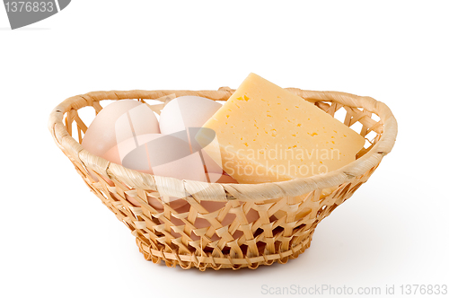 Image of Eggs and cheese lay in a woven basket