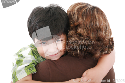 Image of Mother carrying young son looking to camera