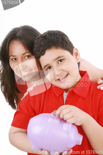 Image of Portrait of a caring mother teaching her son to save money in pi