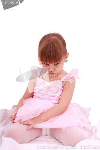 Image of Full length portrait of a sad little ballerina dressed in pink 