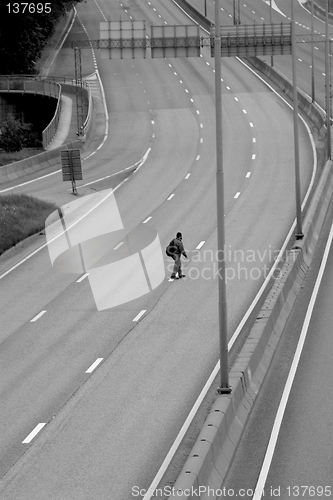 Image of Man crossing the motorway