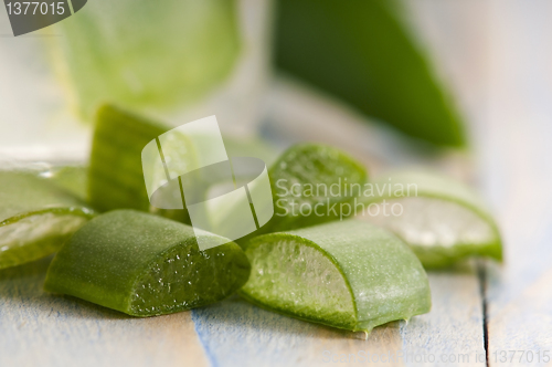 Image of aloe vera juice with fresh leaves