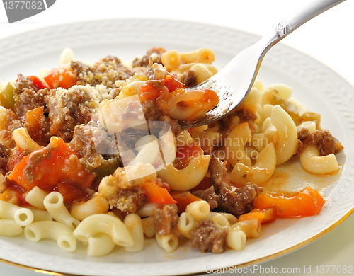 Image of macaroni with sauce and vegetables