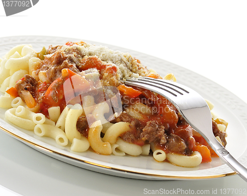 Image of macaroni with sauce and vegetables