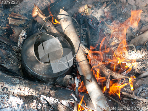 Image of Kettle with boiling water on an open fire