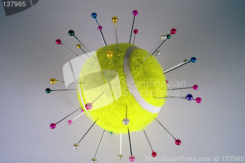 Image of pins and needles on ball