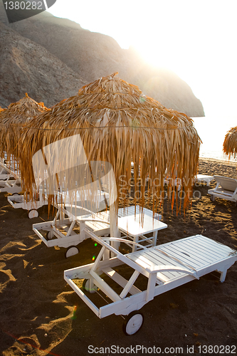 Image of Sunbeds in Perissa, Santorini, Greece