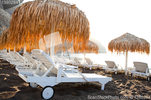 Image of Sunbeds in Perissa, Santorini, Greece