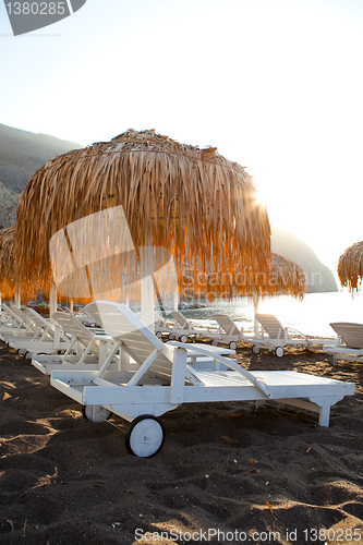 Image of Sunbeds in Perissa, Santorini, Greece