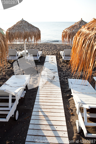 Image of Sunbeds in Perissa, Santorini, Greece