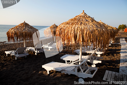 Image of Sunbeds in Perissa, Santorini, Greece