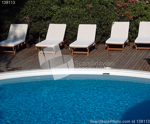 Image of pool with lounge chairs