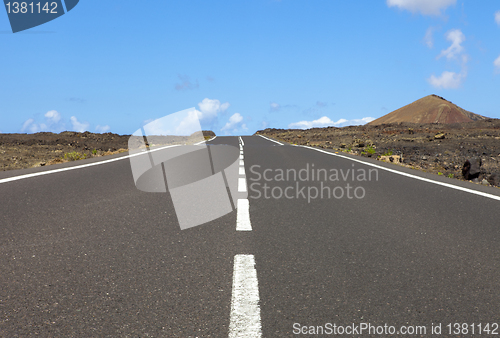 Image of Empty road an arid mountain, Lanzarote, Canary islands, Spain 