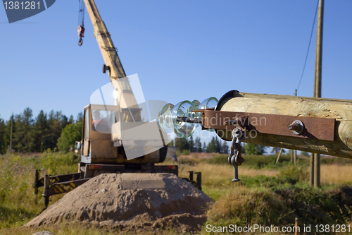 Image of Replacing old power line support