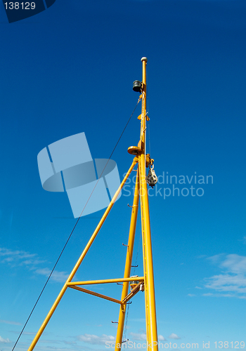 Image of Yellow mast on blue background