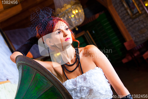 Image of glamour woman in vintage hall interior