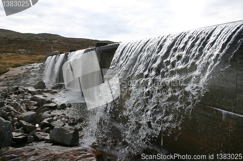 Image of water flows out of the dam on the Hardangervidda in Norway