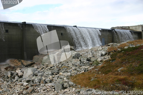 Image of water flows out of the dam on the Hardangervidda in Norway